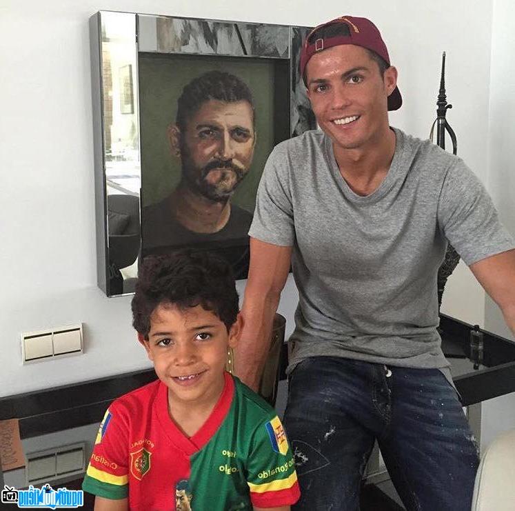 A picture of Cristiano Ronaldo Player and son