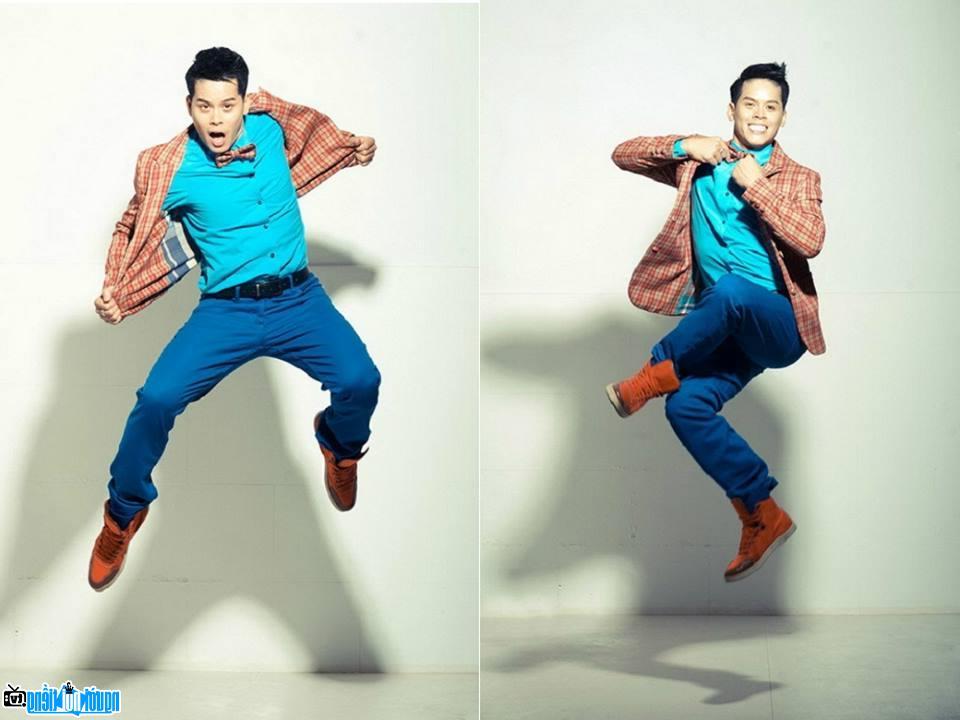 A picture of Dancer John Huy Tran posing in fashion