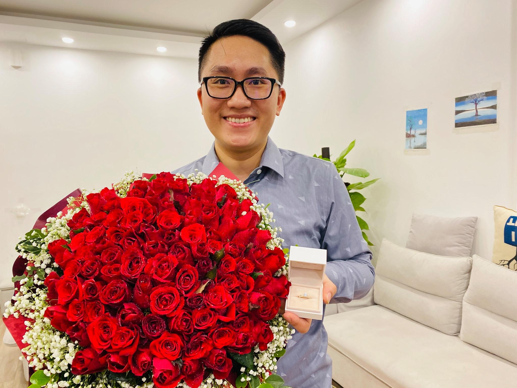 I Love FIFA smiles happily with a bouquet of red roses