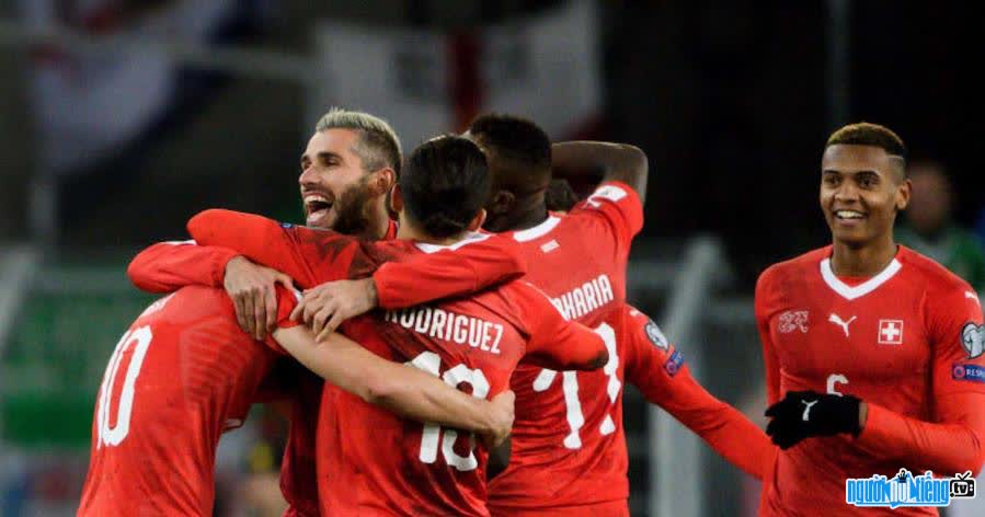 Images of Swiss players celebrating a goal