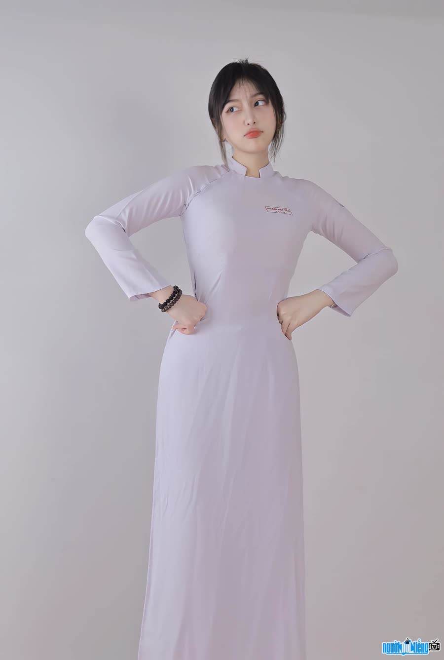 Lovely charming girl in a student ao dai