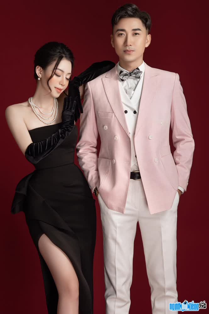 Picture of a happy male MC Ba Tien with his wife