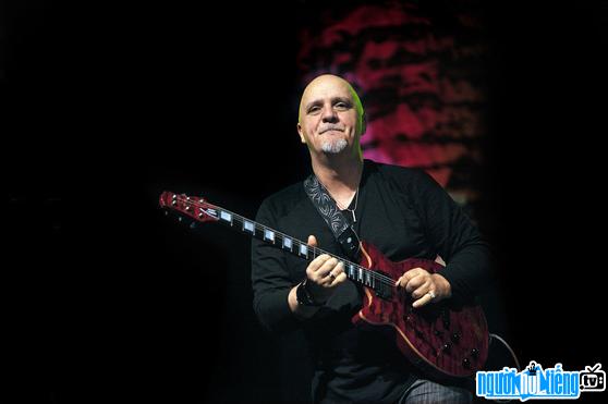 Picture of guitarist Frank Gambale performing on stage
