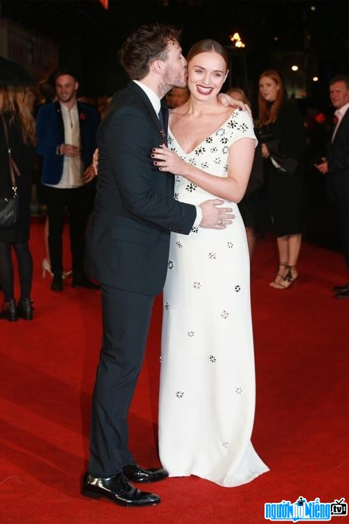 Picture of actress Laura Haddock with her husband at an event