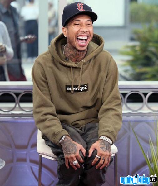 Image of rapper Tyga with a bright smile