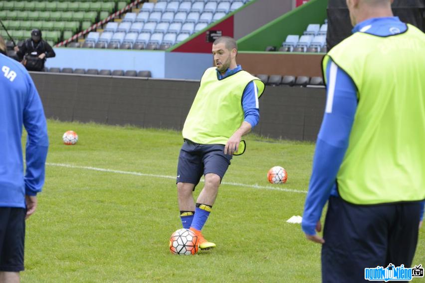 Picture photo of male singer Shayne Ward while practicing soccer on the field