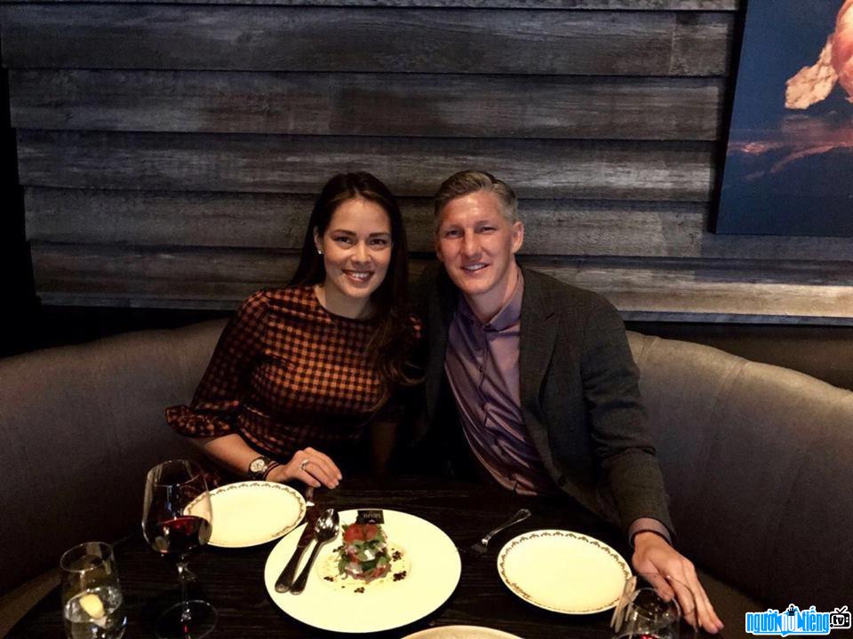 A photo of Bastian Schweinsteiger player with his beloved wife