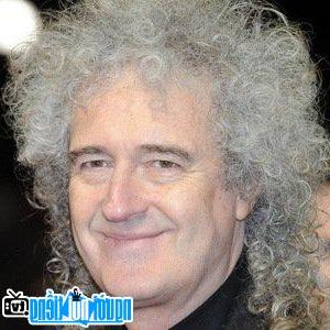 A portrait picture of Guitarist Brian May