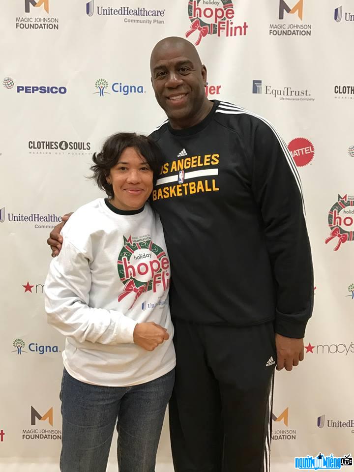 Photo of a former basketball player Magic Johnson with fans