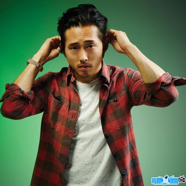 Steven Yeun with a youthful and dynamic style