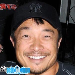 A portrait image of Comedian Jim Lee