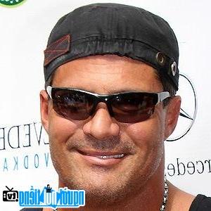 A portrait image of baseball player Jose Canseco