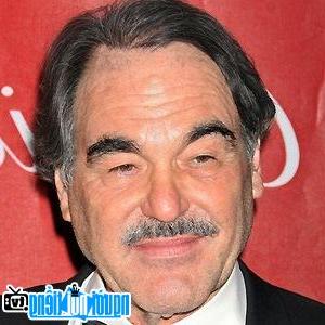 A portrait picture of Director Oliver Stone