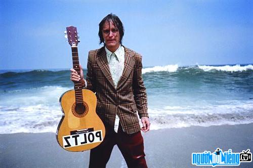 Picture of Steve Poltz playing music on the beach