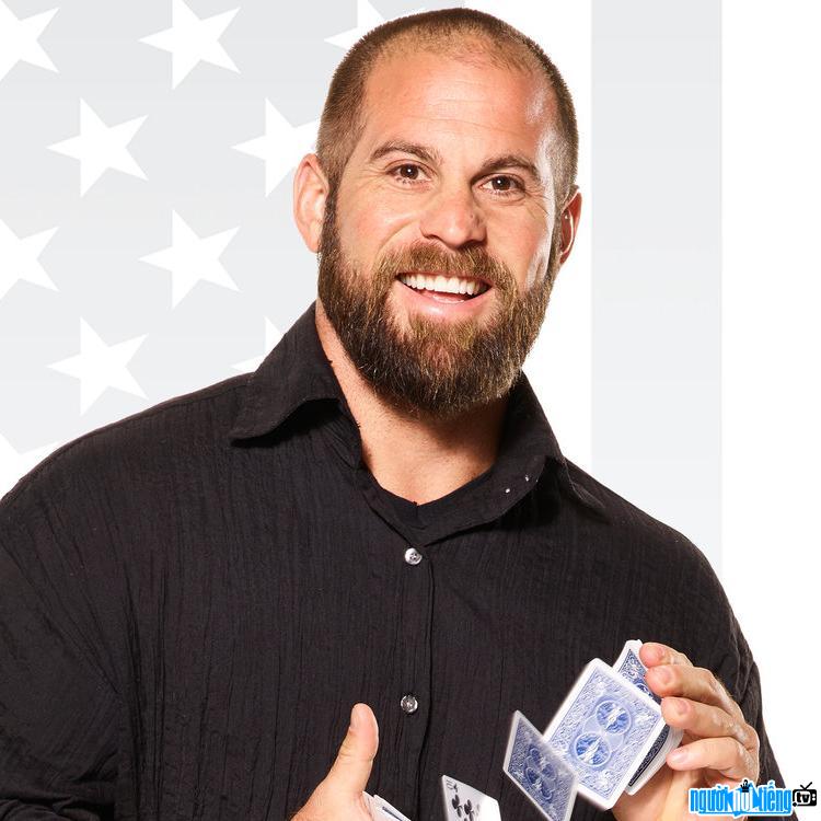 Image of Rugby Player Jon Dorenbos in a magic show with cards