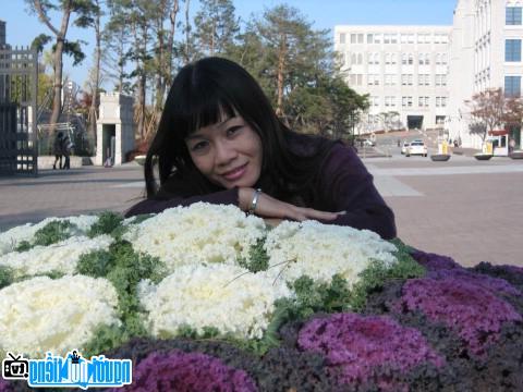  Young writer Vo Thi Xuan Ha with flowers
