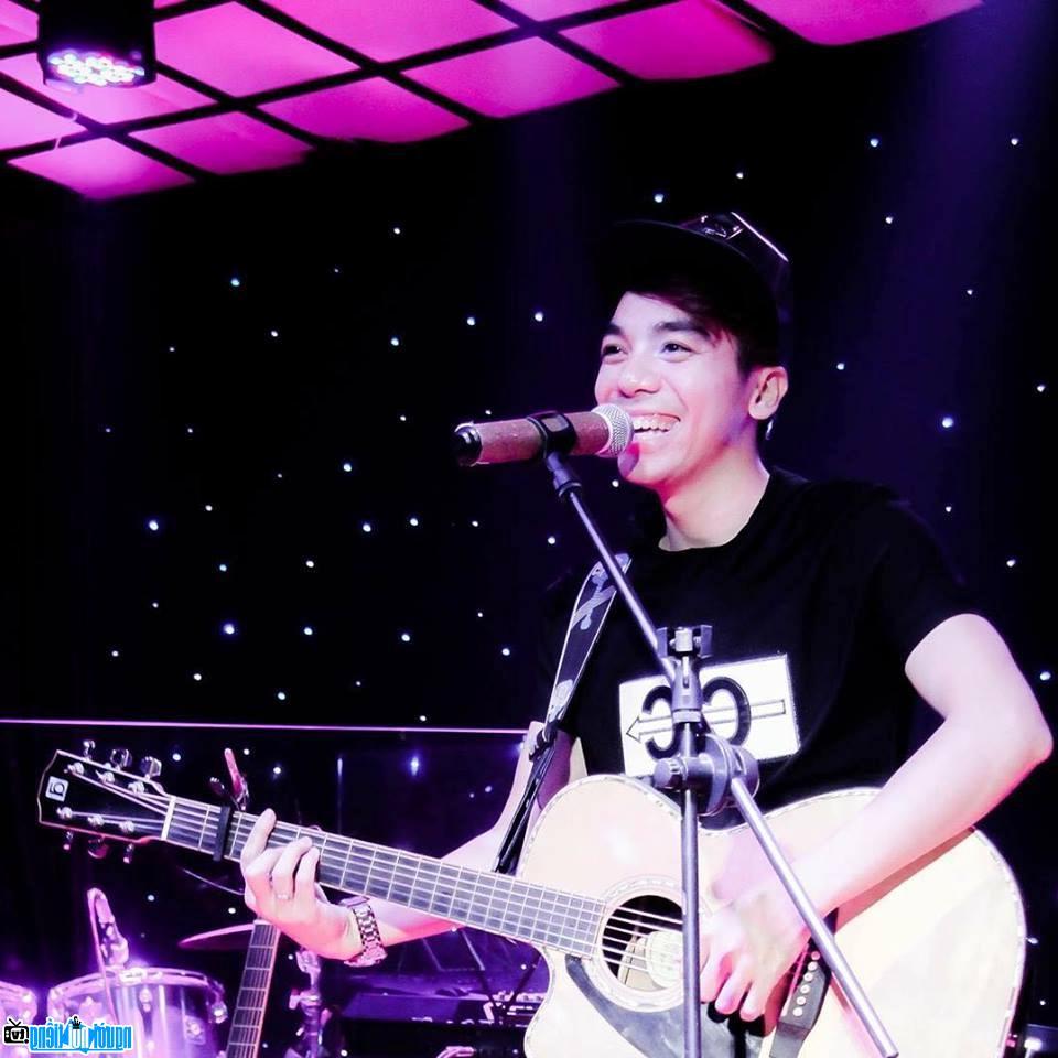  Singer Ngo The Phuong while singing and playing