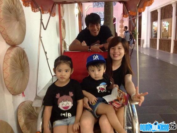 Nguyen Huu Ha is happy with his wife and children.