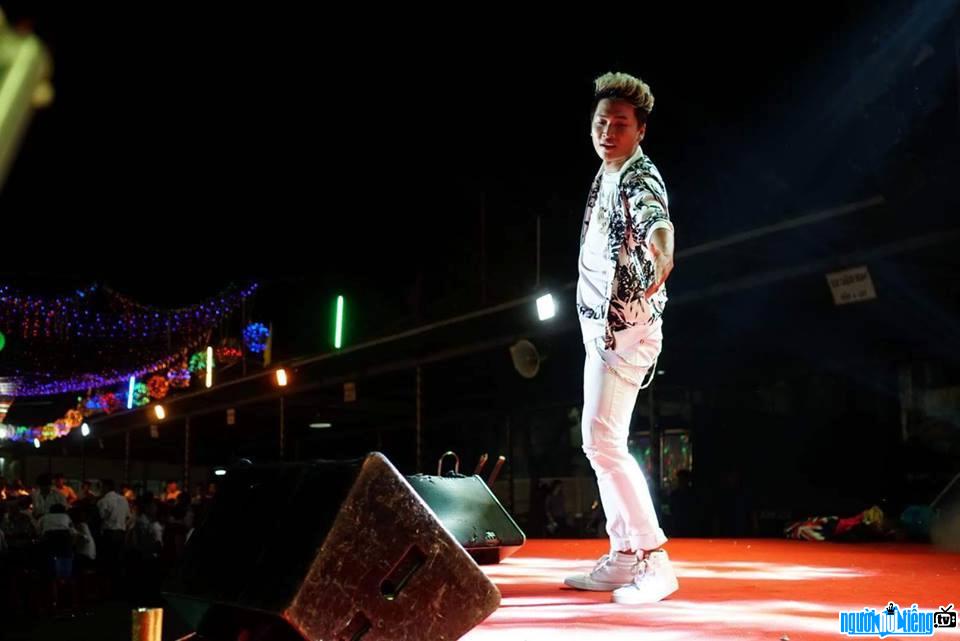 The image of singer Tuan KC performing on stage