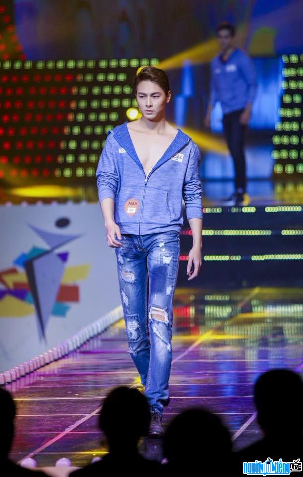 Picture of singer Jay Quan on a catwalk on a fashion stage