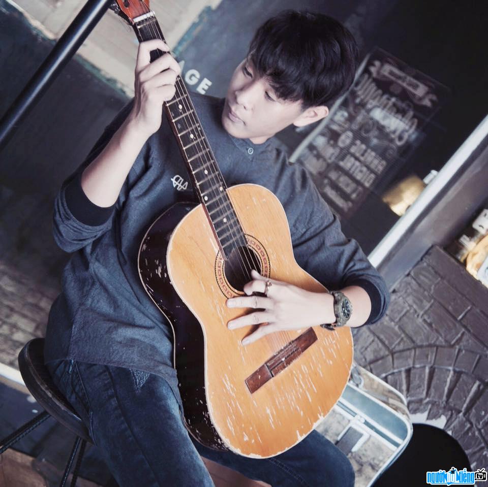  Dinh Tran Bao Khanh showing off his guitar playing skills
