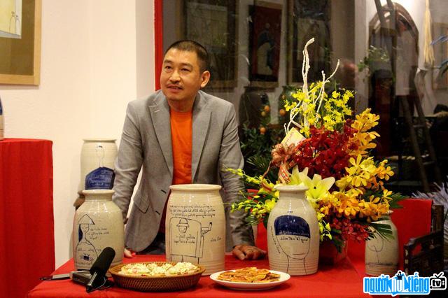  Picture of painter Le Thiet Cuong in his exhibition