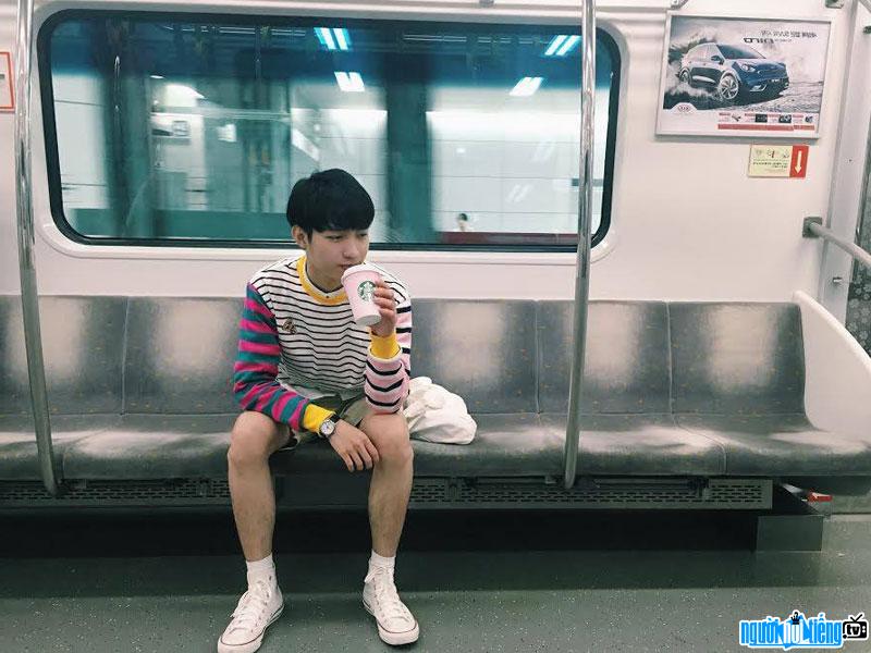 Image of hot boy Pham Le Anh Duc alone sitting on a tram