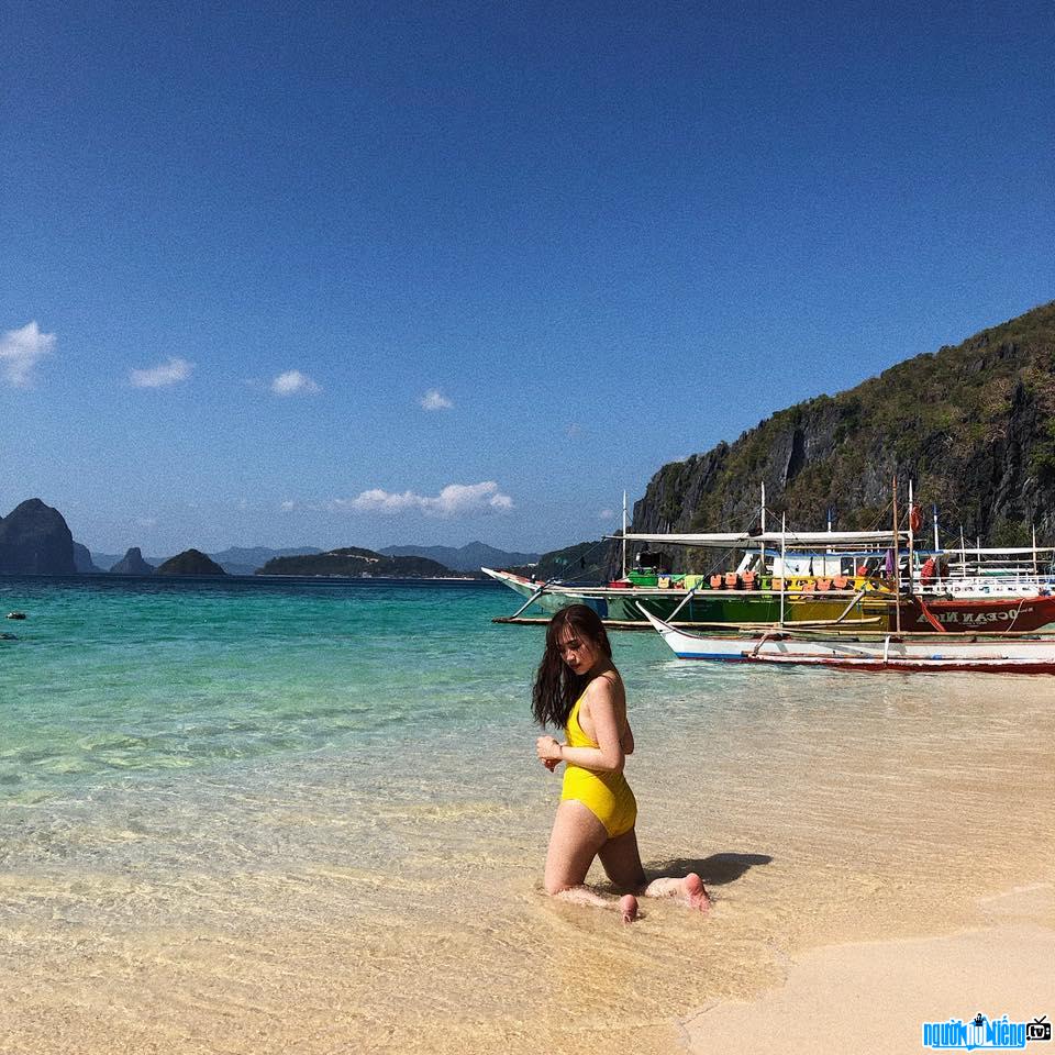  Joyce Pham poses in a bikini on the beach