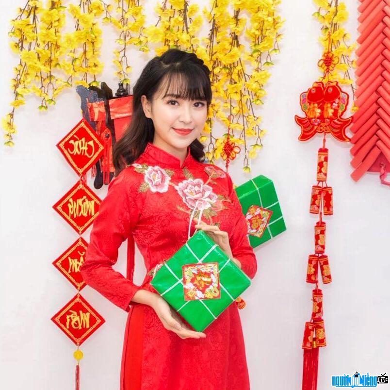  Kim Oanh wearing a red Ao Dai to welcome Tet