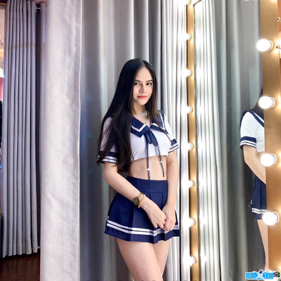  young and beautiful Thuy Linh with a schoolgirl style
